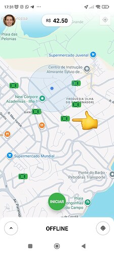 A map interface showing a highlighted route with a cost of R$42.50 and a finger pointing at a specific location near Freguesia Ilha of Madeira in the city. (Captioned by AI)