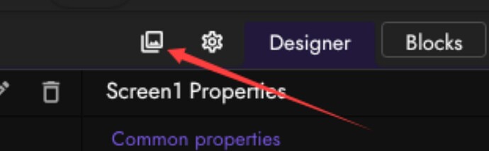 A screenshot of a software interface highlighting an icon with a red arrow, showing the 'Designer' and 'Blocks' tabs along with 'Screen1 Properties.' (Captioned by AI)