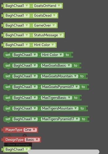 The image shows a block-based programming interface with code blocks configuring game parameters for 'BaghChaal1,' including variables related to goats, tigers, game status, and player and design types. (Captioned by AI)